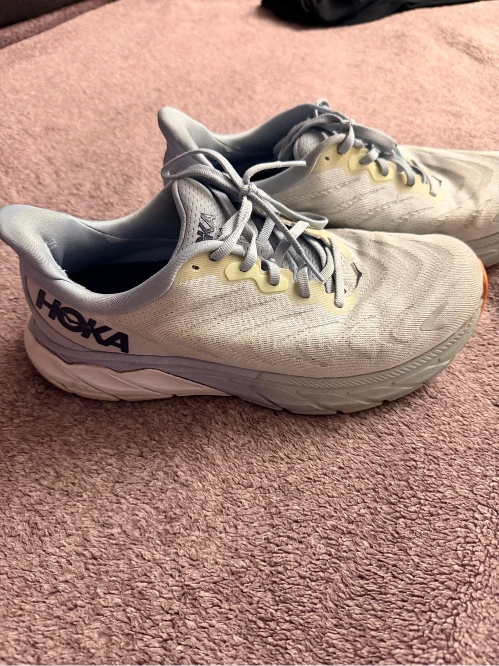 Hoka light gray and yellow running shoes